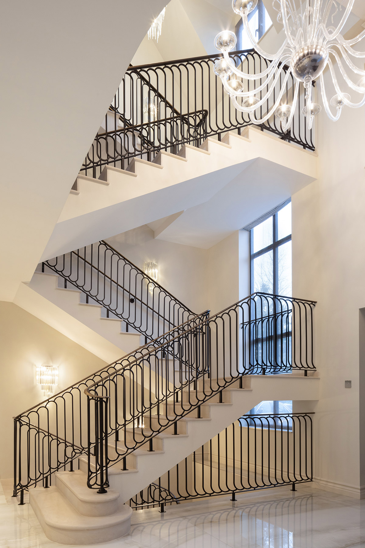 White Staircase with Black Iron Railings